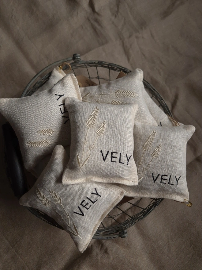 Irish linen embroidered lavender bags sachet in a wire basket
