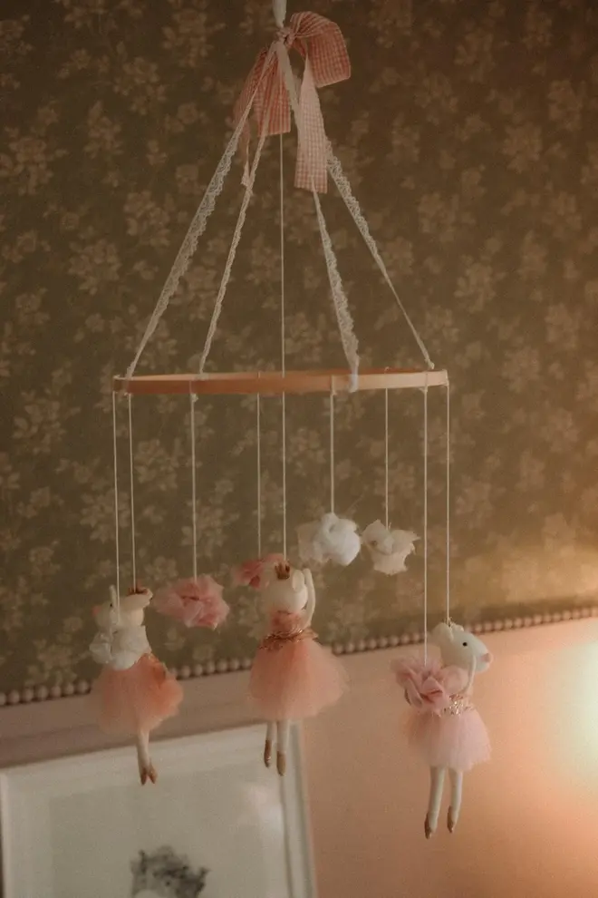 Hanging Mice Ballerina Felt Carousel Decoration, a hanging mice carousel decoration suspended in a child's decorated bedroom. 