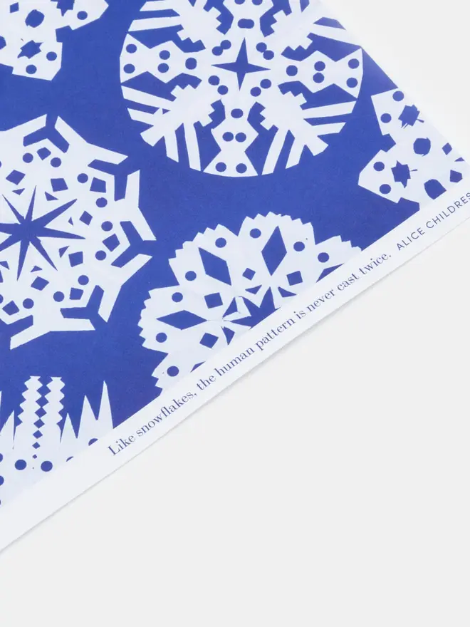 blue wrapping paper with white snowflaked