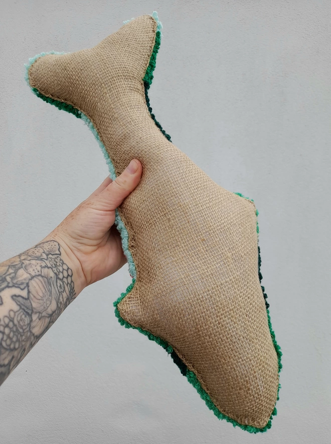 Hessian backing on decorative fish cushion 