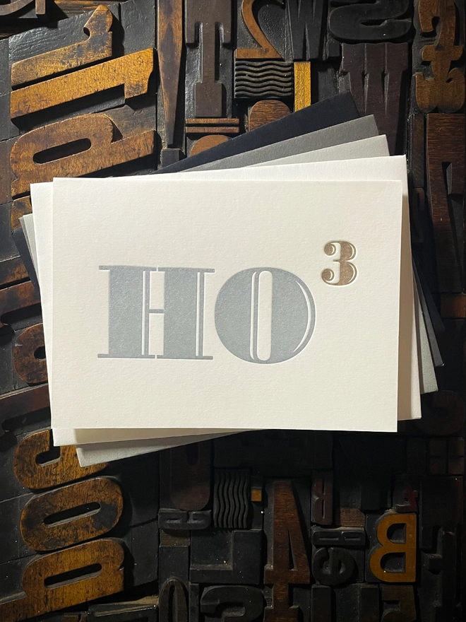 Ho Ho Ho! A beautiful typographic letterpress Christmas card. Printed in rich metallic silver and gold inks with luxury matching and contrasting envelopes; ideal to send to your designer friends at the festive season.