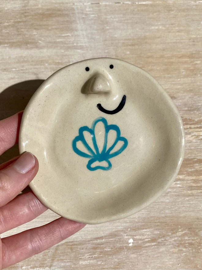 shell ceramic trinket tray - held