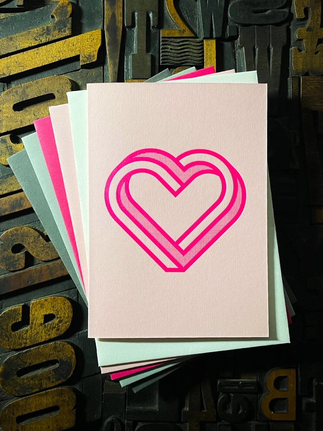 Valentine! A beautiful infinity heart monogram letterpress card printed with rich fluorescent pink ink on thick Candy Pink card with a luxury matching envelope; ideal to send a to a friend or loved one.