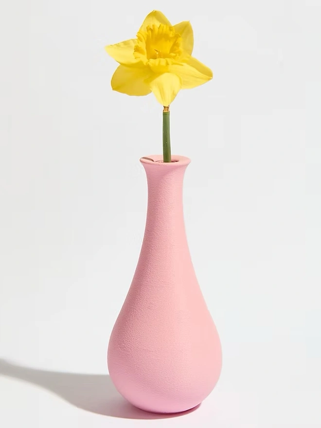 pink 3d printed vase in tear drop shape with yellow flower