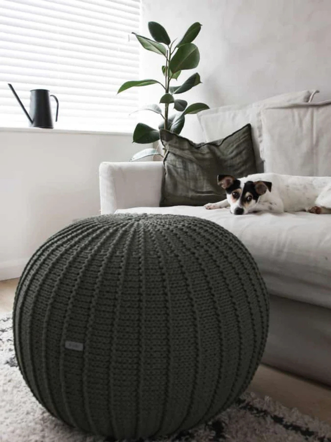 Zuri House. Large olive green knitted pouffe.