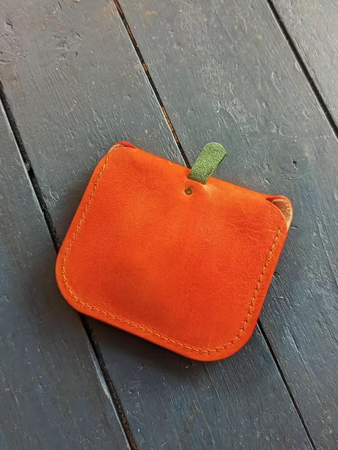 Back view of handmade leather Jack O' Lantern pumpkin purse.