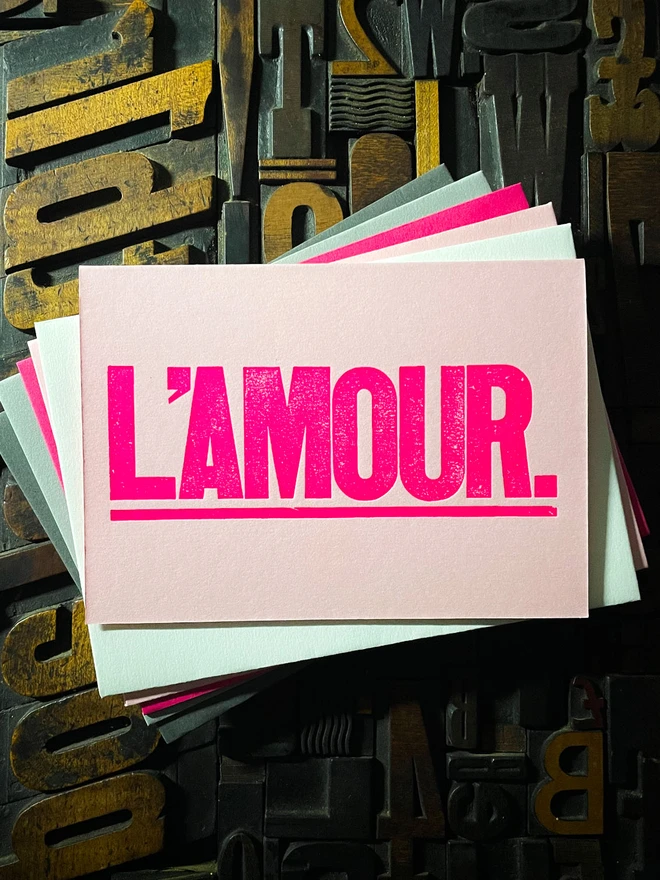 L’Amour! A beautiful wooden type letterpress card printed with rich fluorescent pink ink on thick Candy Pink card with a luxury matching envelope; ideal to send a to a friend or loved one.