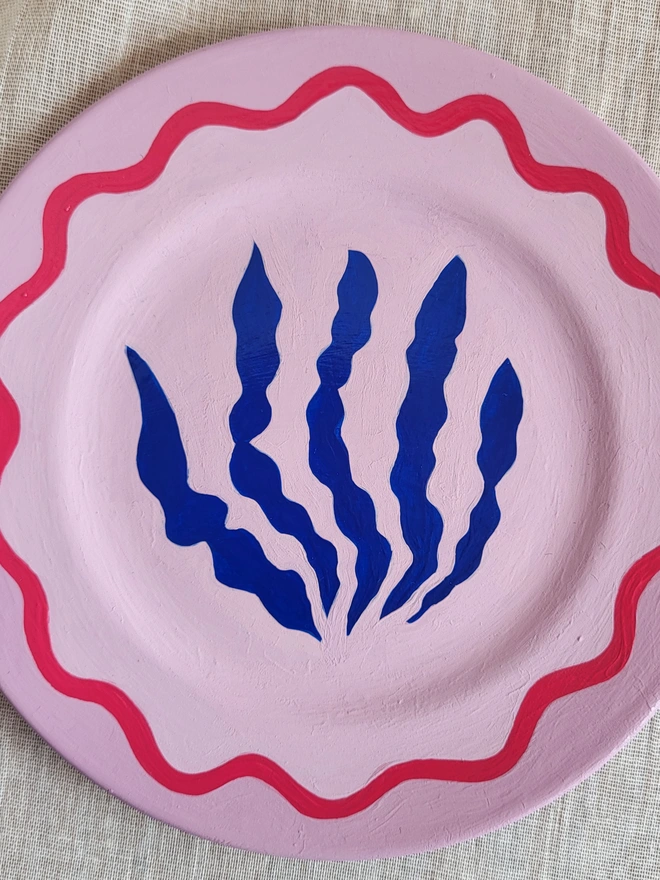 Pale lilac plate with cobalt blue seaweed motif