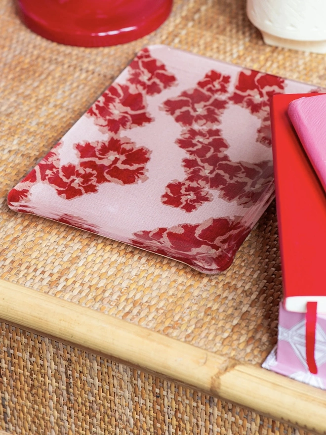 Acrylic Midi Tray, a colourful and patterned tray on a hamper. 