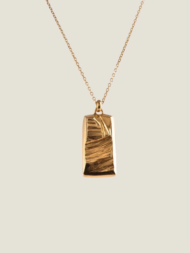 stunning rough gold ingot style pendant