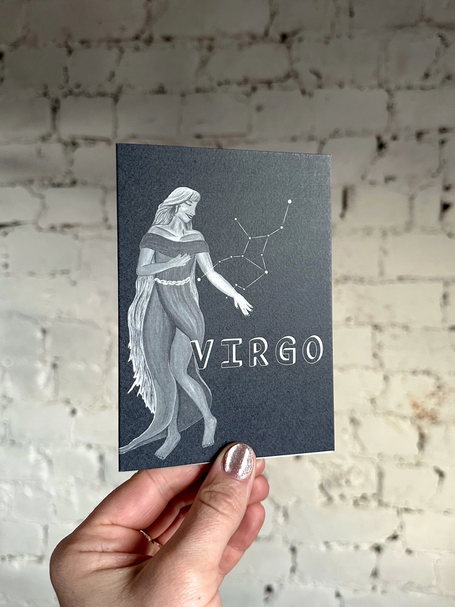  a greetings card featuring a greyscale illustration of a zodiac style maiden with the text “VIRGO”