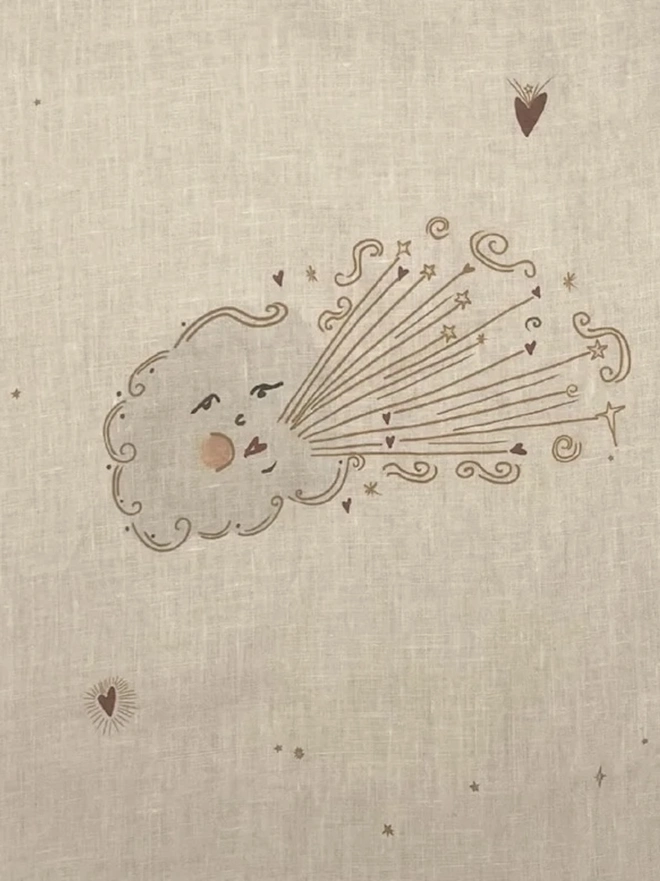 'Love Cloud' Linen Tea Towel, a person holding up a tea towel with a cloud motif on it. 