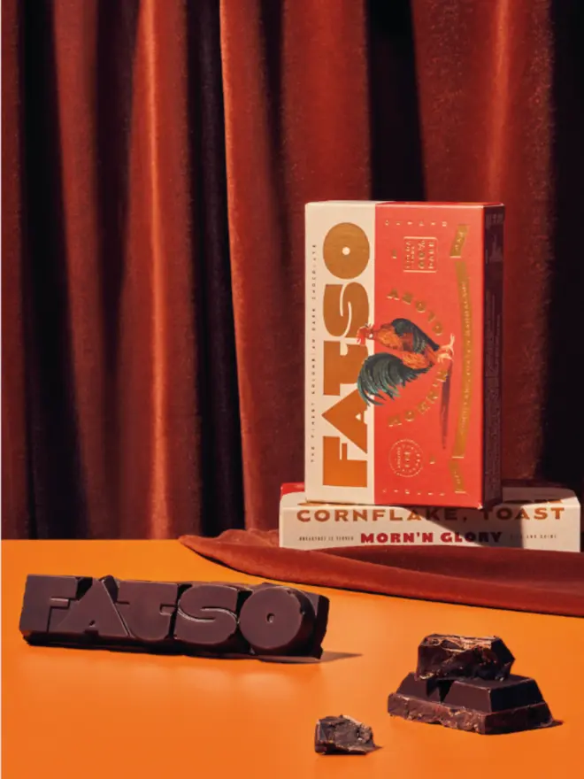 'MORN'N GLORY' Cornflake & Toast Vegan Chocolate Bar open to show the chocolate on a table