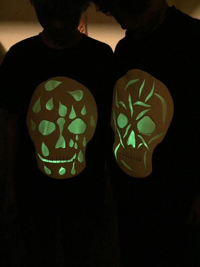 Two people with skull glow in the dark tshirts 
