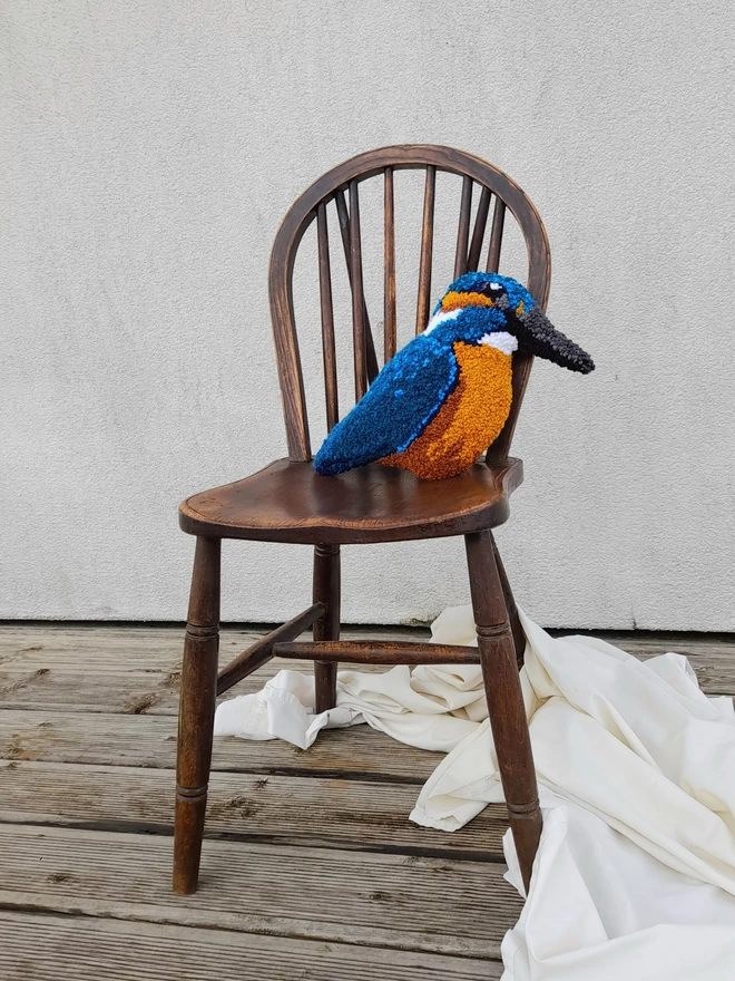 Majestic Kingfisher Cushion Perched on Vintage Wooden Chair
