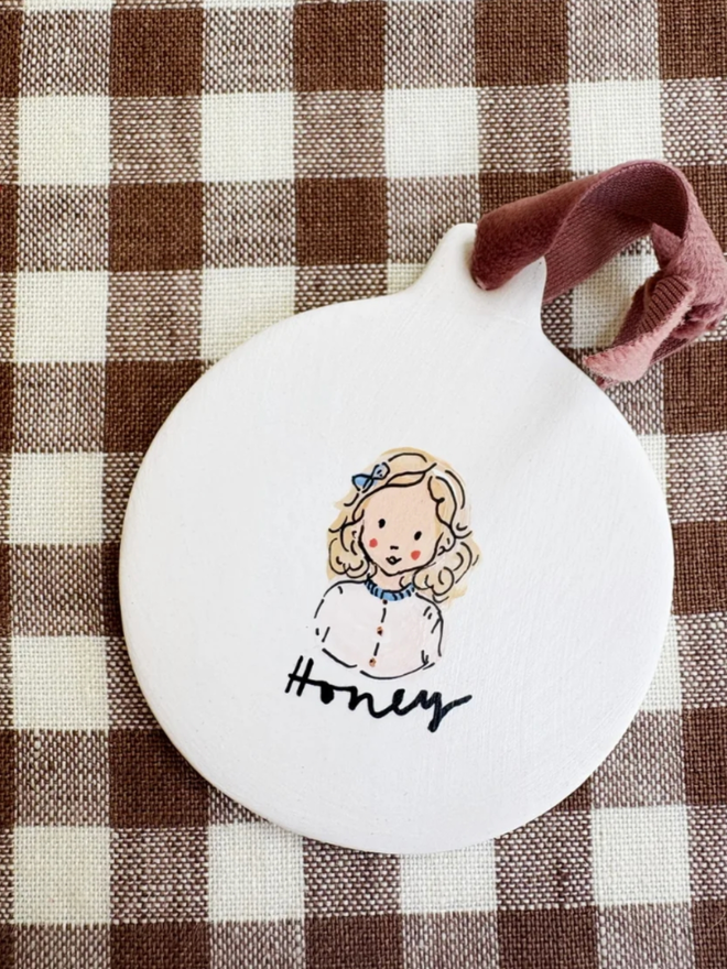 Flat Bauble. A personalised and illustrated flat bauble.
