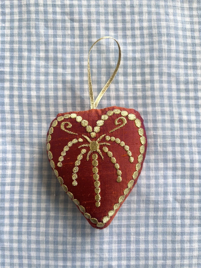 Silk heart ornament: rust silk, gold thread and ribbon