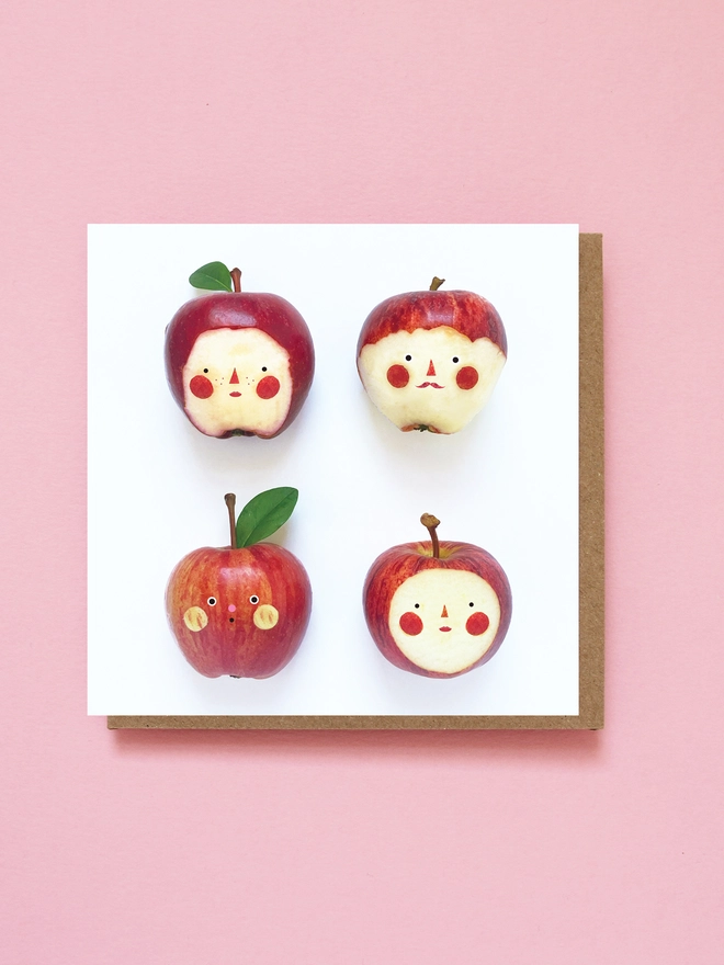 4 Red apples with faces 