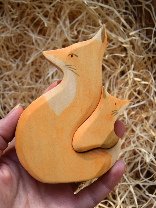 wooden toy snuggling fox pair