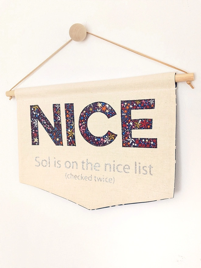 Nice appliqued on a banner in Liberty Christmas animal fabric, fresh from Santa's nice list