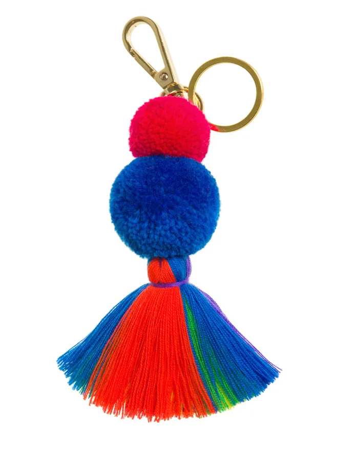 Pom Pom and Tassel Keyring or bag charm with a blue and red pom pom and a rainbow tassel