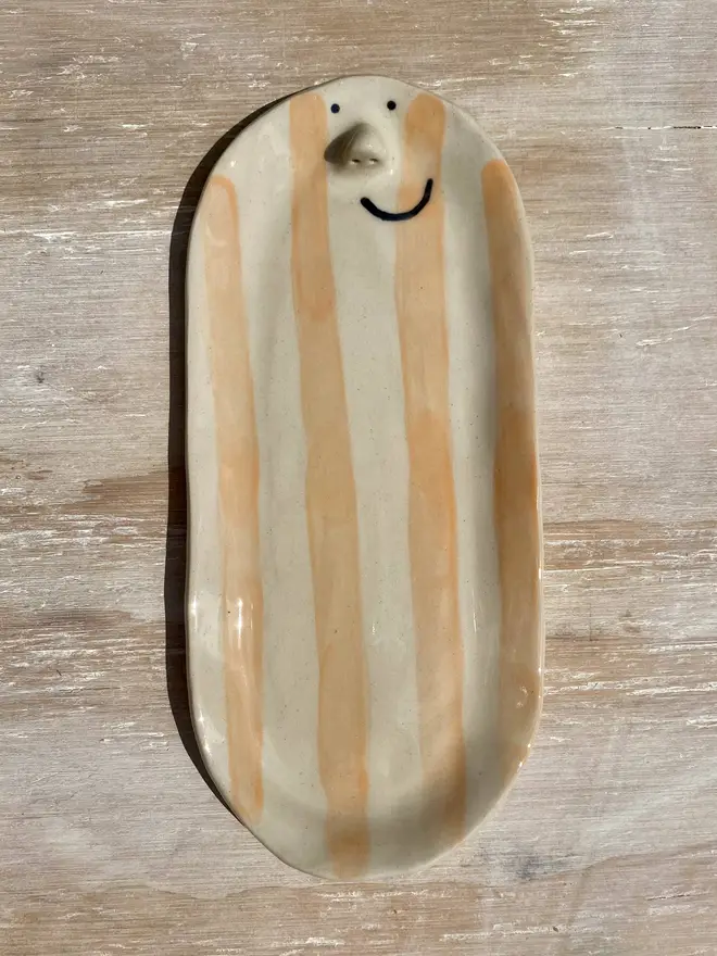 pastel orange long trinket dish front on