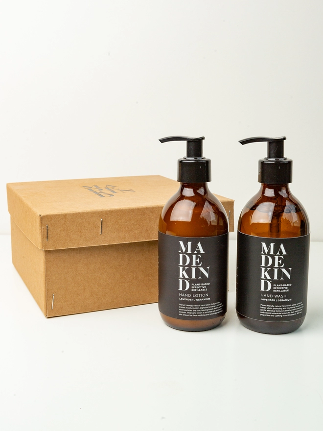 natural hand wash and hand lotion next to gift box