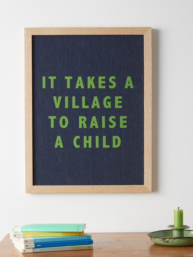 It takes a village to raise a child navy linen print with green typography
