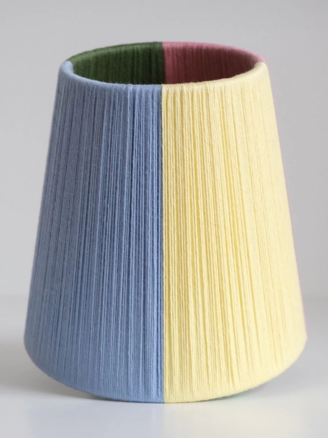 Quarter colourblock lampshade upright showing blue and yellow