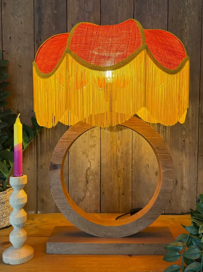Tangerine Hessian Petal Lampshade With Butterscotch, in a room. 