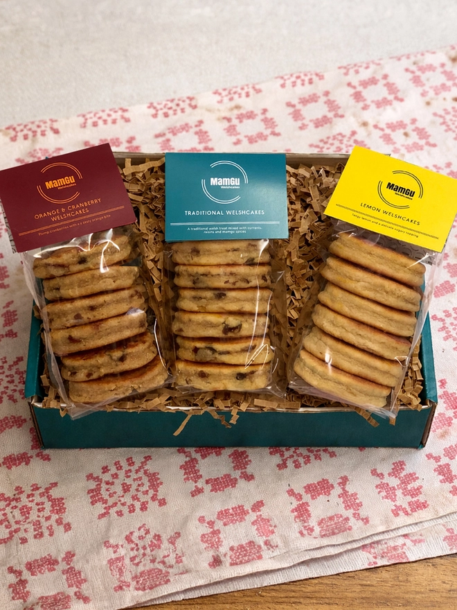 3 Packs of Welsh Cakes in a teal box on a table cloth