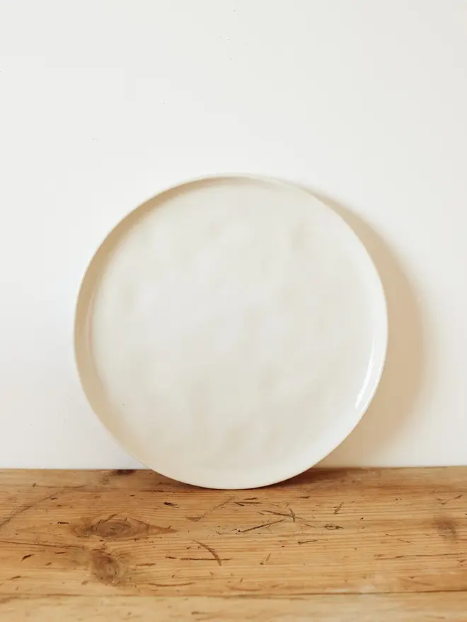 stoneware place setting dining set. a large white stoneware plate.