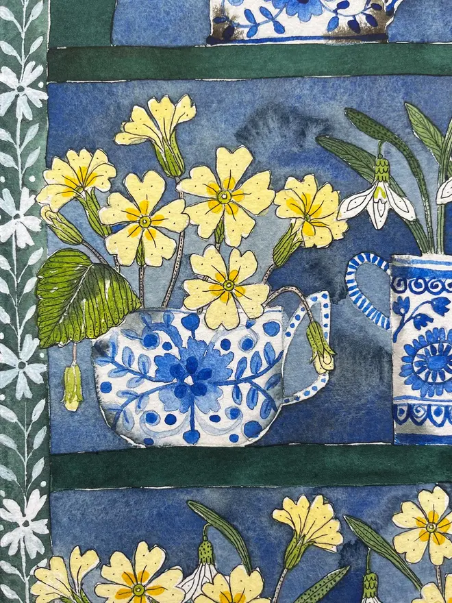 Snowdrops and primroses in delftware, ceramic mugs displayed in a plant Theatre print