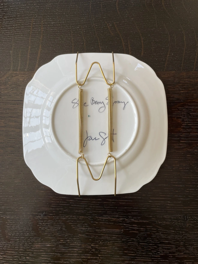 plate hanger on back of sloe berry painting plate