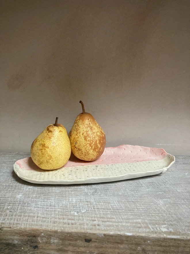 pink porcelain platter with pears