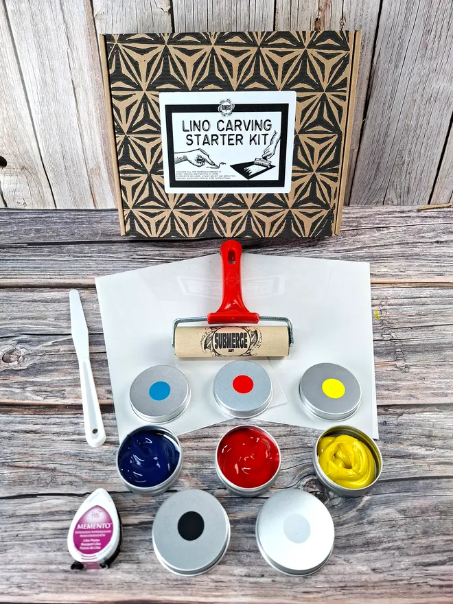 Lino carving and printing stamp kit showing brayer and inks