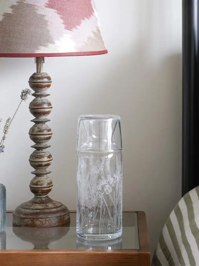 Floral Mini Carafe & Glass Set, on a clear table. 
