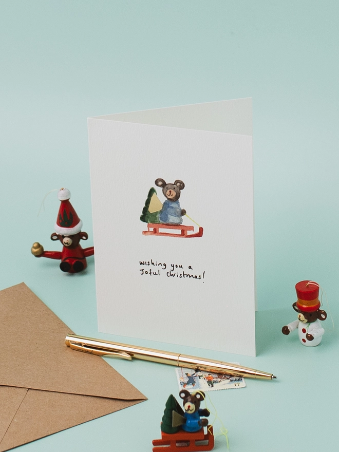 Sledging Bear Christmas Card 