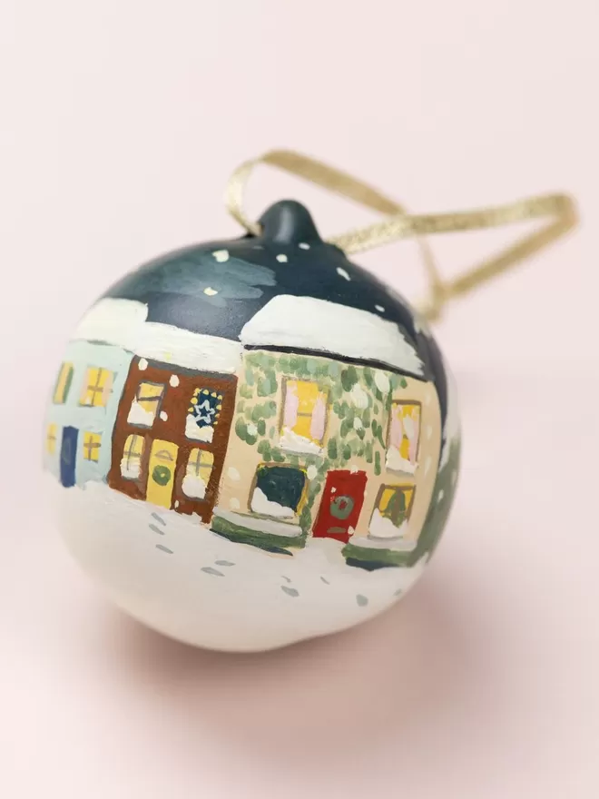 Hand painted village on a Christmas bauble 
