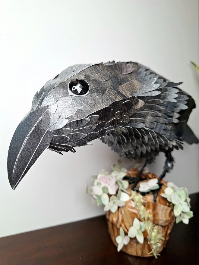 Beak view 9f a raven paper sculpture