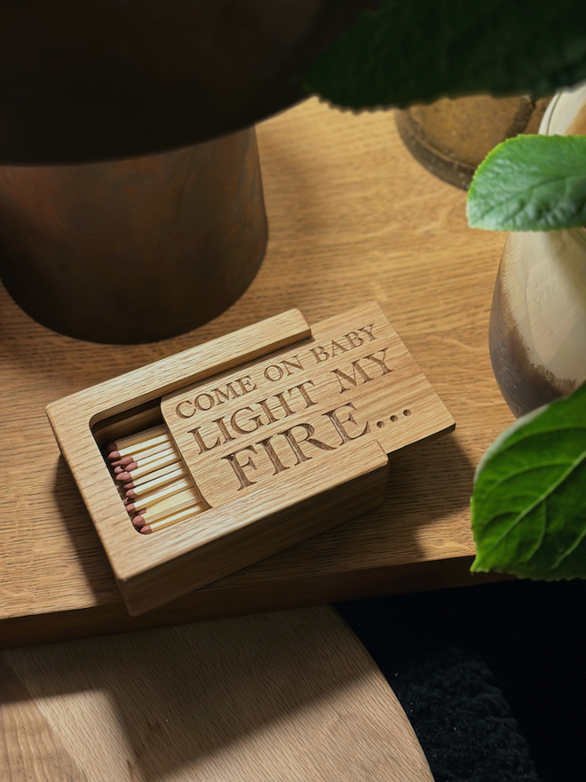 Oak Matchbox with big matches and a candle at  angle