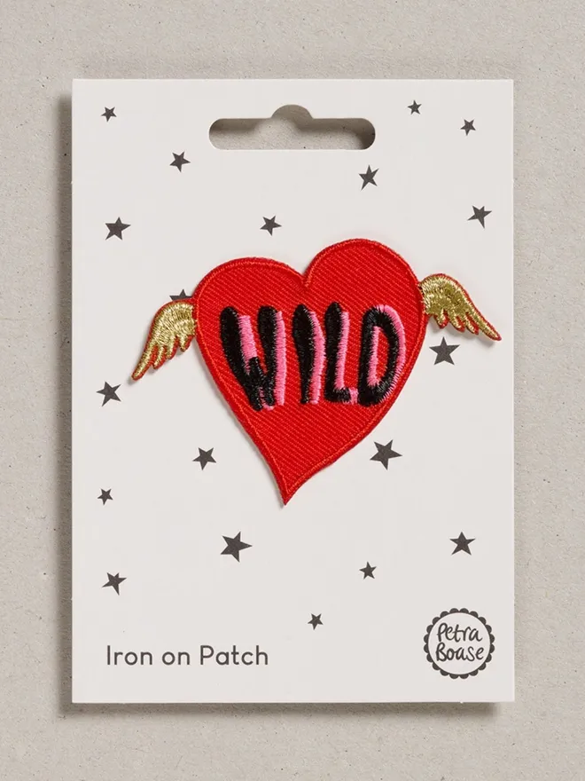 Wild heart with gold wings and wild word iron on embroidered fabric patch. 
