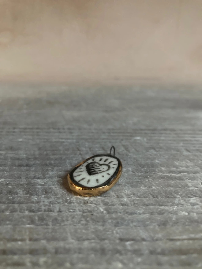 porcelain heart pendant flat lay