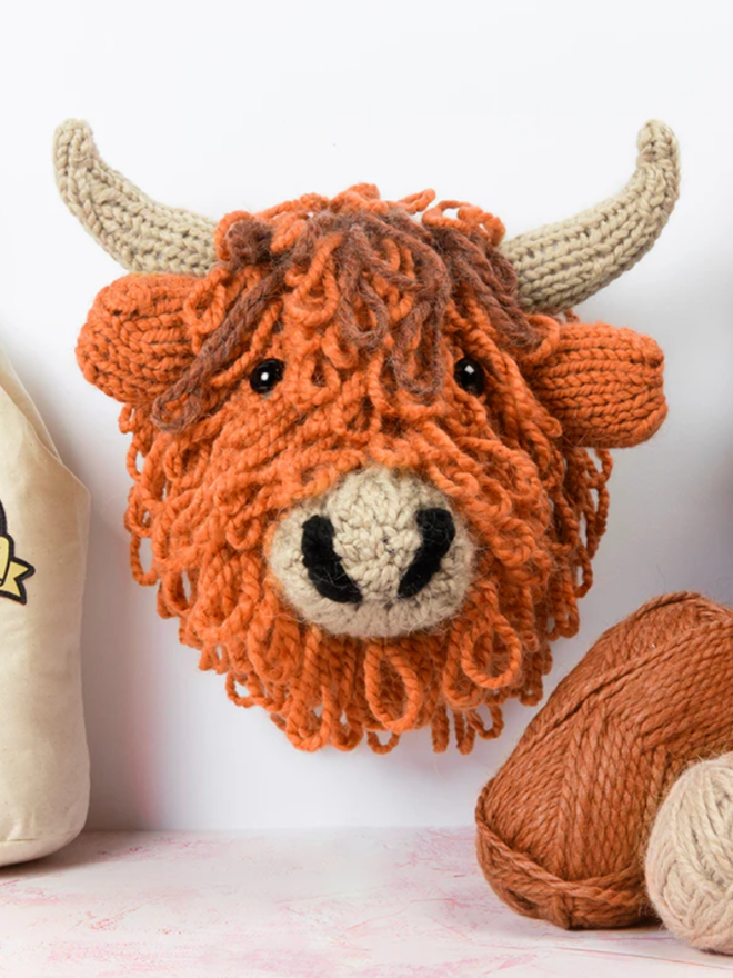 Giant Highland Cow Head Knit Kit. A giant orange highland cow head, knitted. 