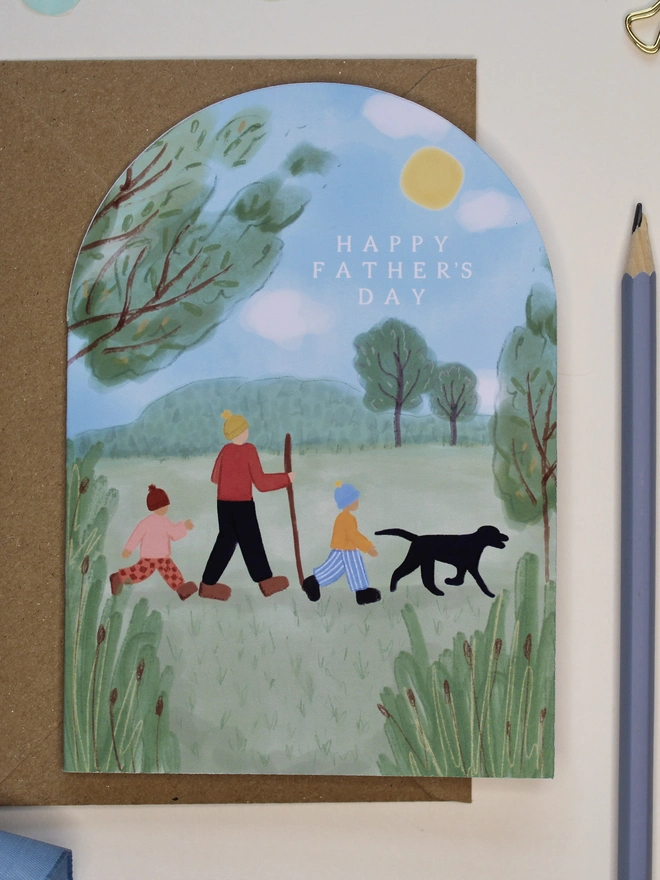 arch shape fathers day card featuring a family walk in nature