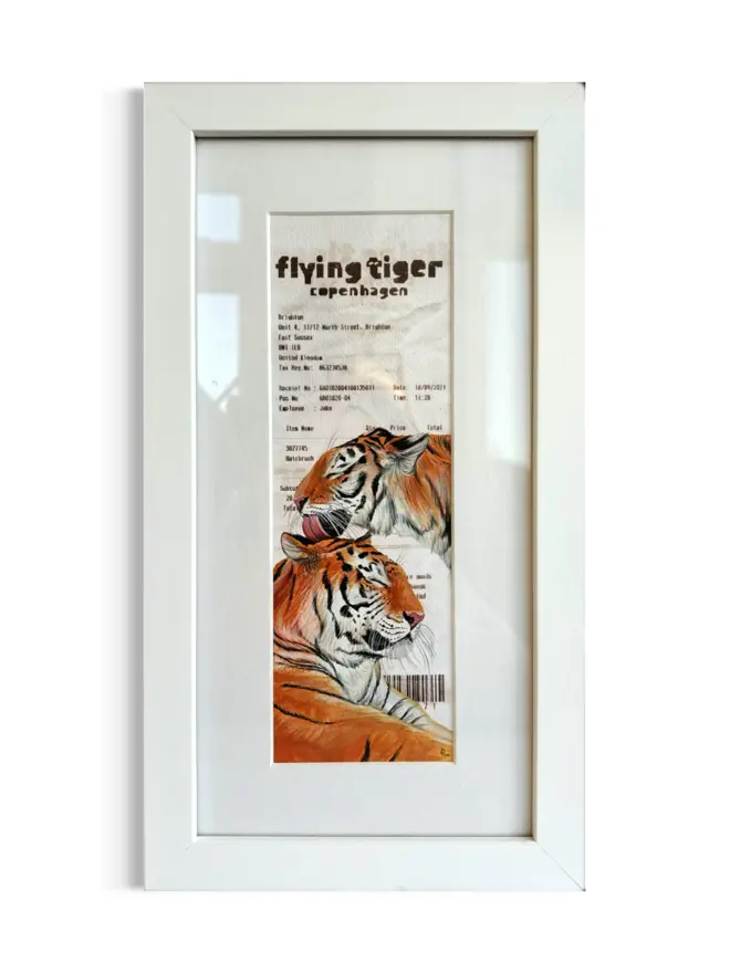 Hairbrush Flying Tiger Receipt Print, against a white wall. 