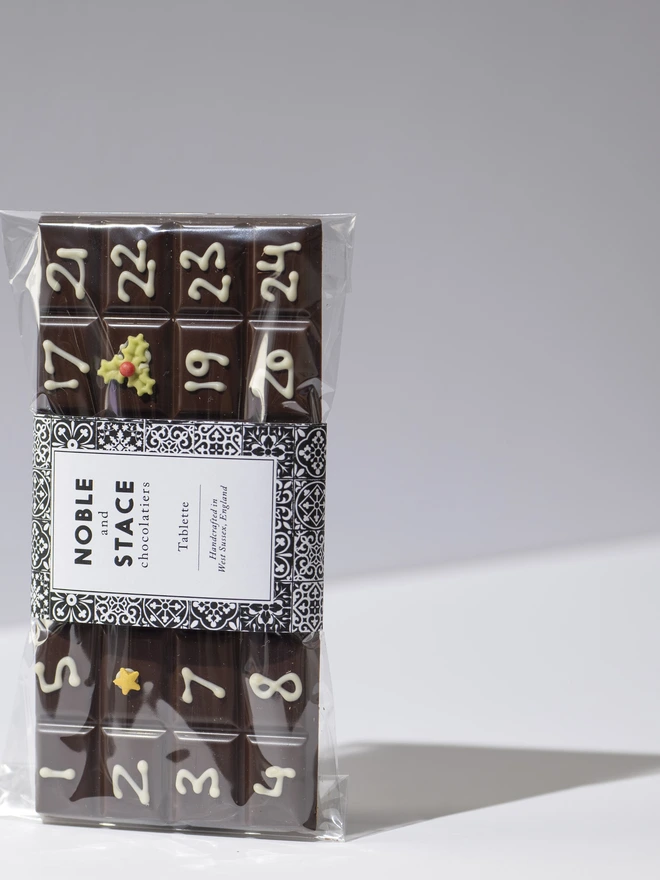 A solid bar of chocolate hand piped with December dates from the 1st to the 24th. 