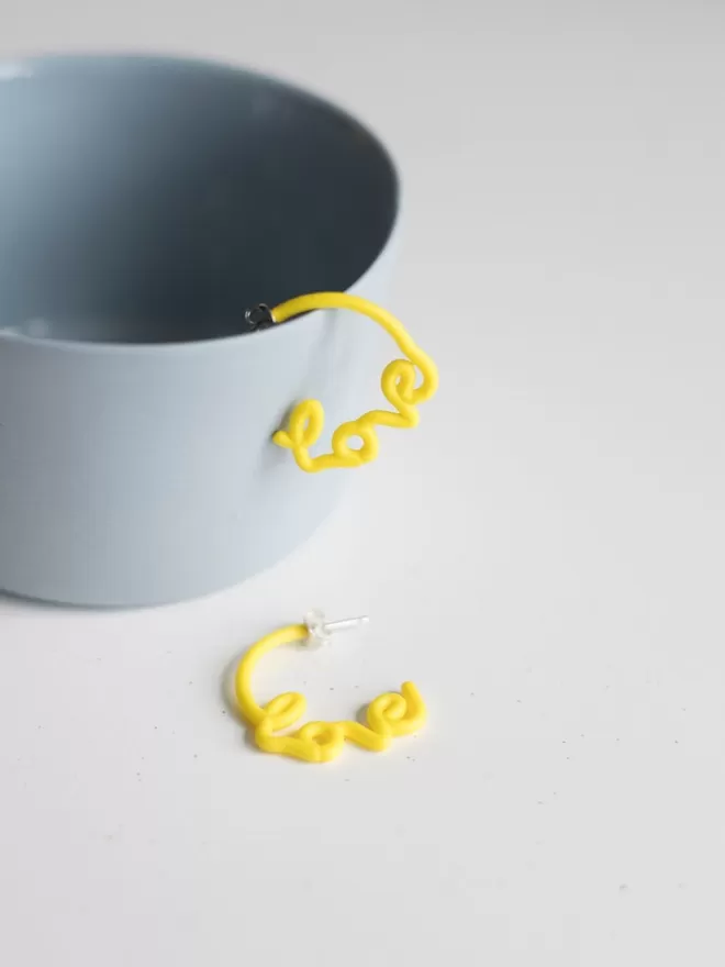 Small yellow love hoops by Zoe Sherwood.