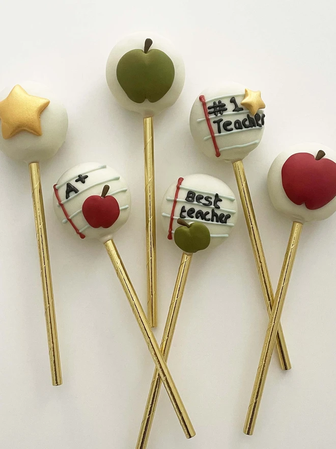 Teacher Thank You cake pops (Pack of 6, 12, 18, 24). 6 cakes pops Decorated with Gold Stars, Apples and positive notes for your favourite teacher placed on a white background. Perfect gift for Teachers.
