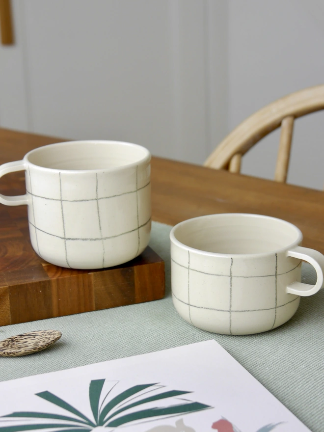 Large and small handmade grid pattern mugs